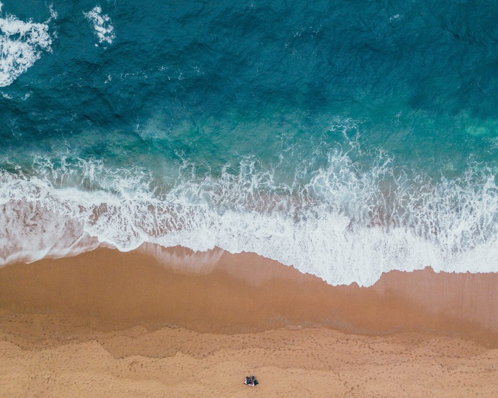 The breakpoint between ocean and the sand. 