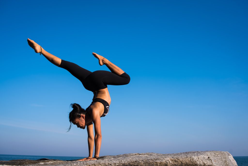 Take A Yoga Class! Well that lady is doing a handstand on a cliff